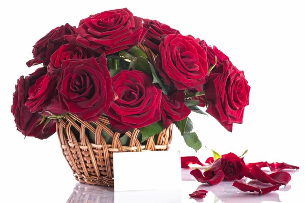 A basket of red roses with a note