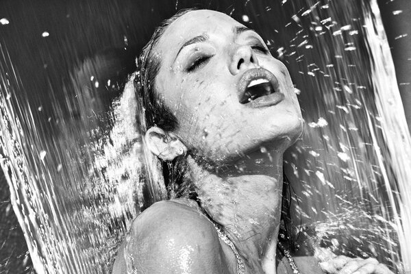 Black and white photo of Angelina Jolie under water