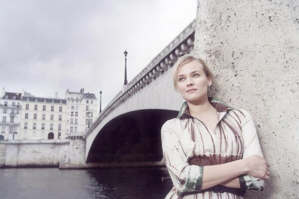 A girl in the city by the river