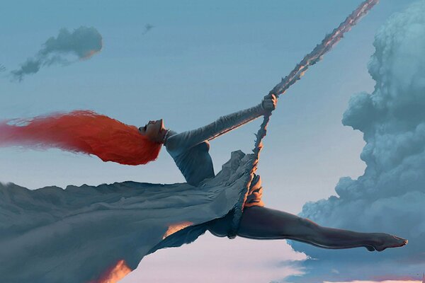 A girl swinging against the sky with red hair