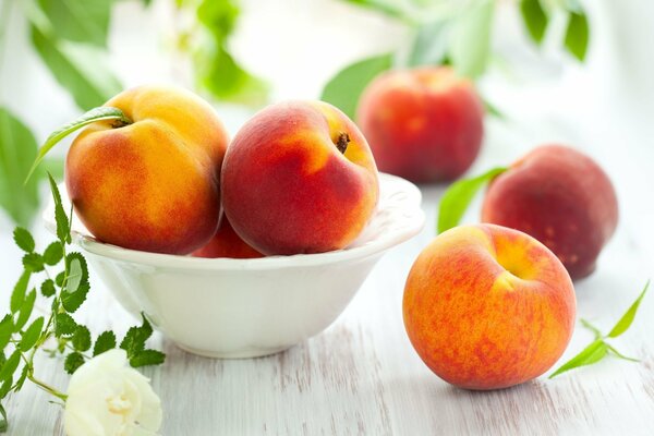 Ripe peach on the background of a stylish table