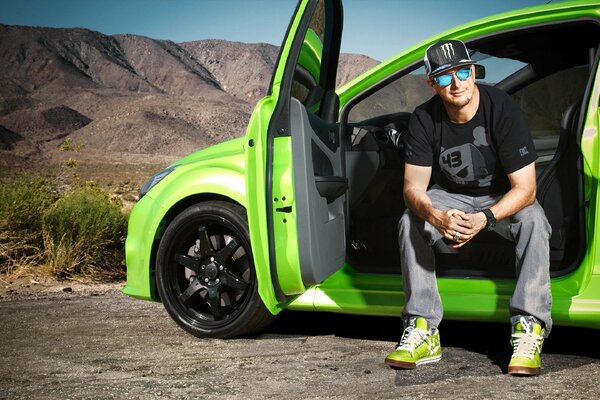 Racer Ken Block in a green Ford focus