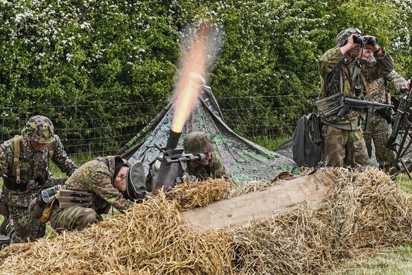 Flame from a mortar. Military reconstruction of the battle