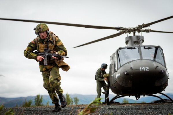 The combat helicopter landed to disembark the soldiers