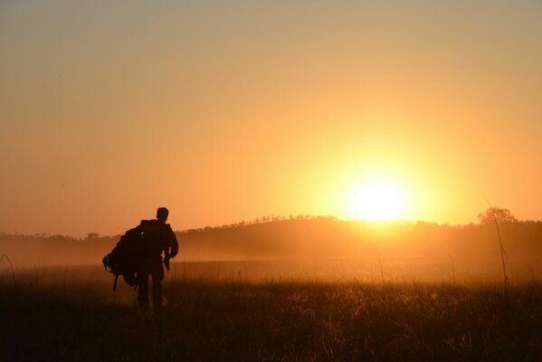 A soldier in the morning in the field