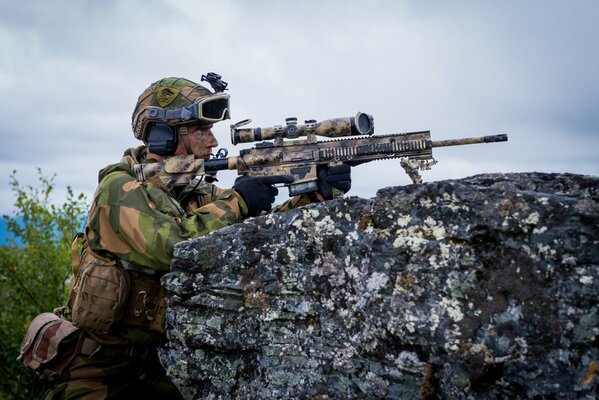 A Norwegian sniper is sitting in ambush