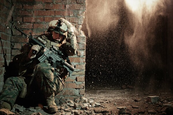 The soldier hid behind the wall from the explosion