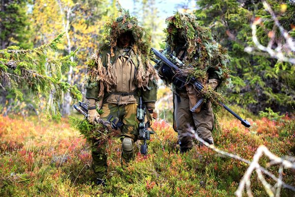 Masked soldiers with weapons are standing