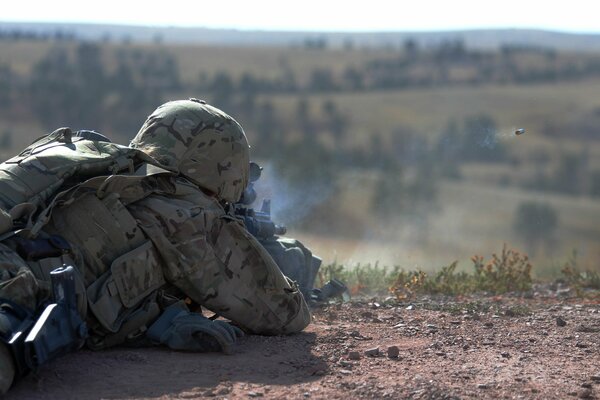 A soldier makes a shot. Flying Bullet