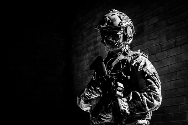 Black and white image of a soldier with a weapon