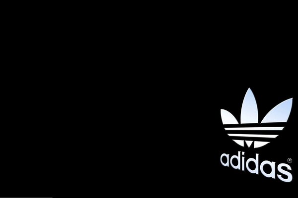 Adidas logo on a black background