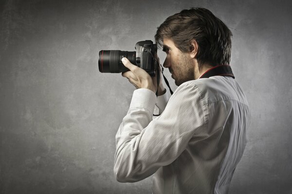 A guy in a white shirt with a camera