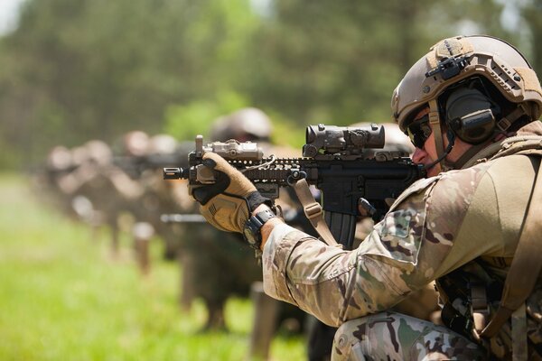 A soldier with a gun in his hands