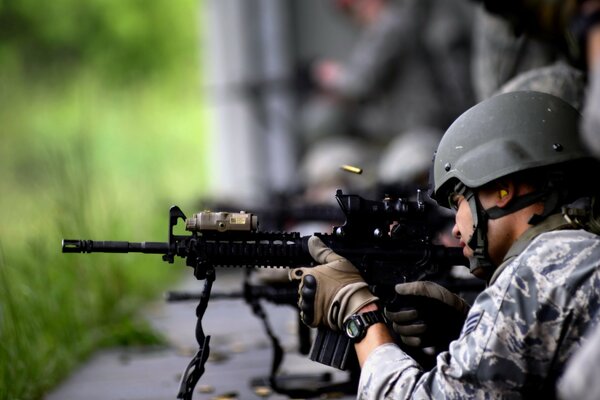 The army, the soldier is sitting in ambush