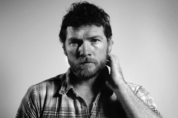 The famous courageous actor Sam Worthington in a shirt