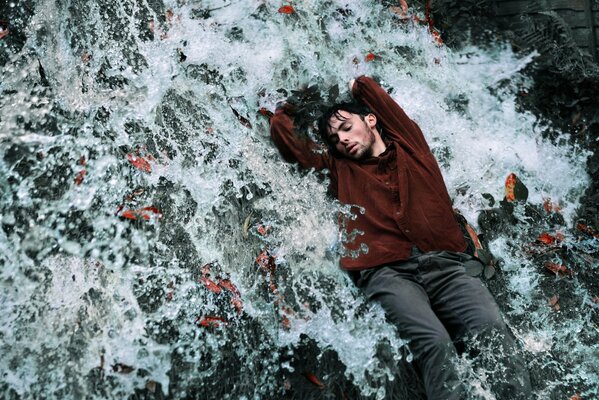 Photo shoot of a guy under a stream of water