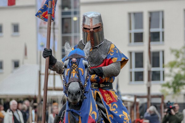 Knight in metal armor on a horse