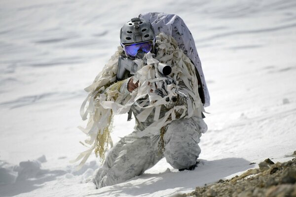 A Navy Seal soldier is aiming at the target