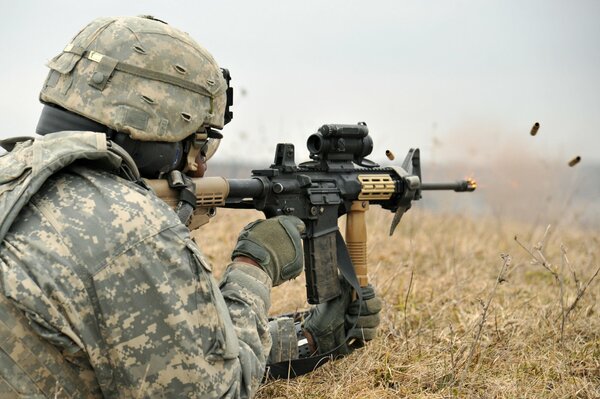 A soldier with a gun. Gun shooting