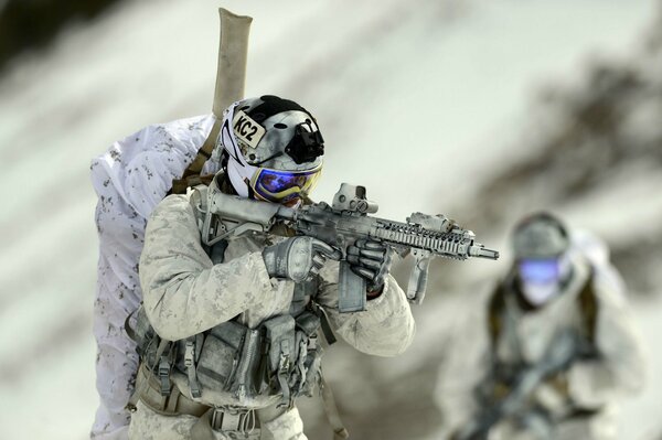 A soldier in uniform with a gun