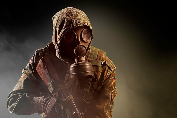A man soldier in a gas mask with a gun game