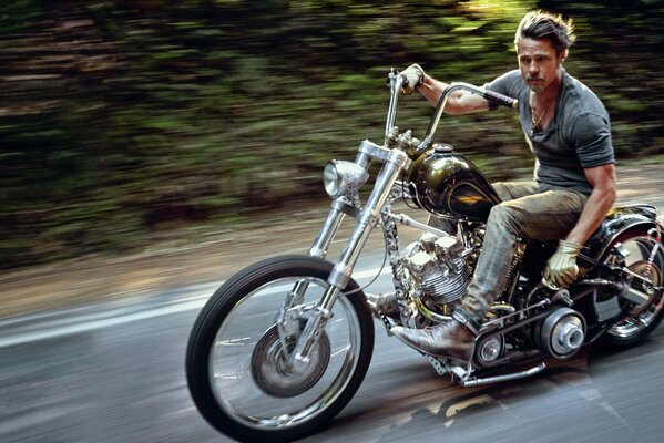 Brad Pitt rides a motorcycle