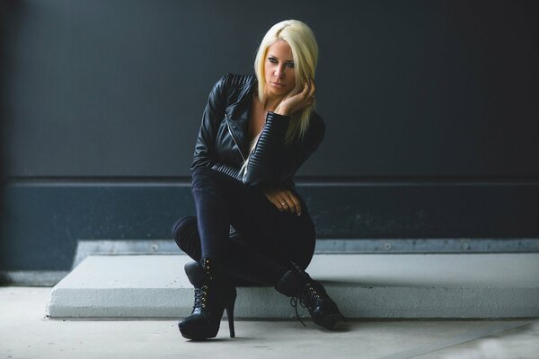 Blonde angela kutscher in a black jacket and heels