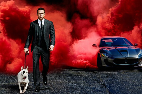 Actor Channing Tatum on the background of scarlet smoke