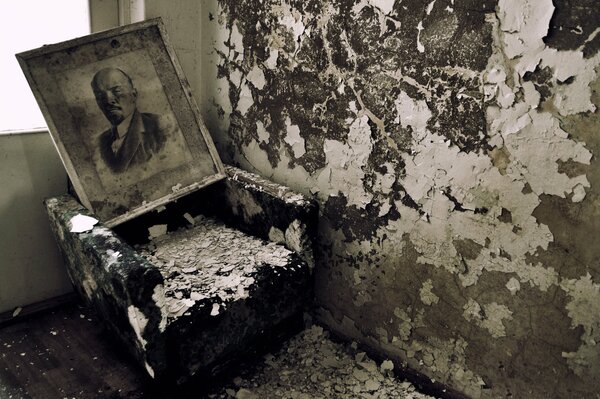 An old portrait of Lenin in an abandoned house