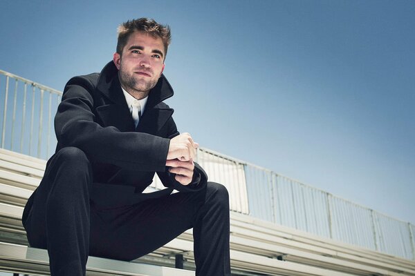 Robert Pattinson poses for a photo shoot for the British edition