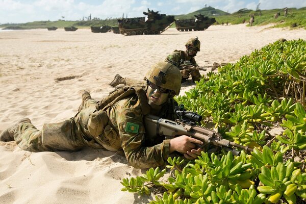 An Australian Army soldier with a gun in his hands, on a mission