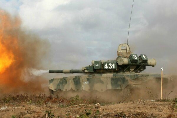 Military equipment T-80 tank in action salvo