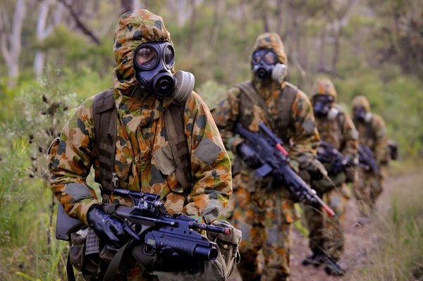 Soldiers in camouflage with equipment