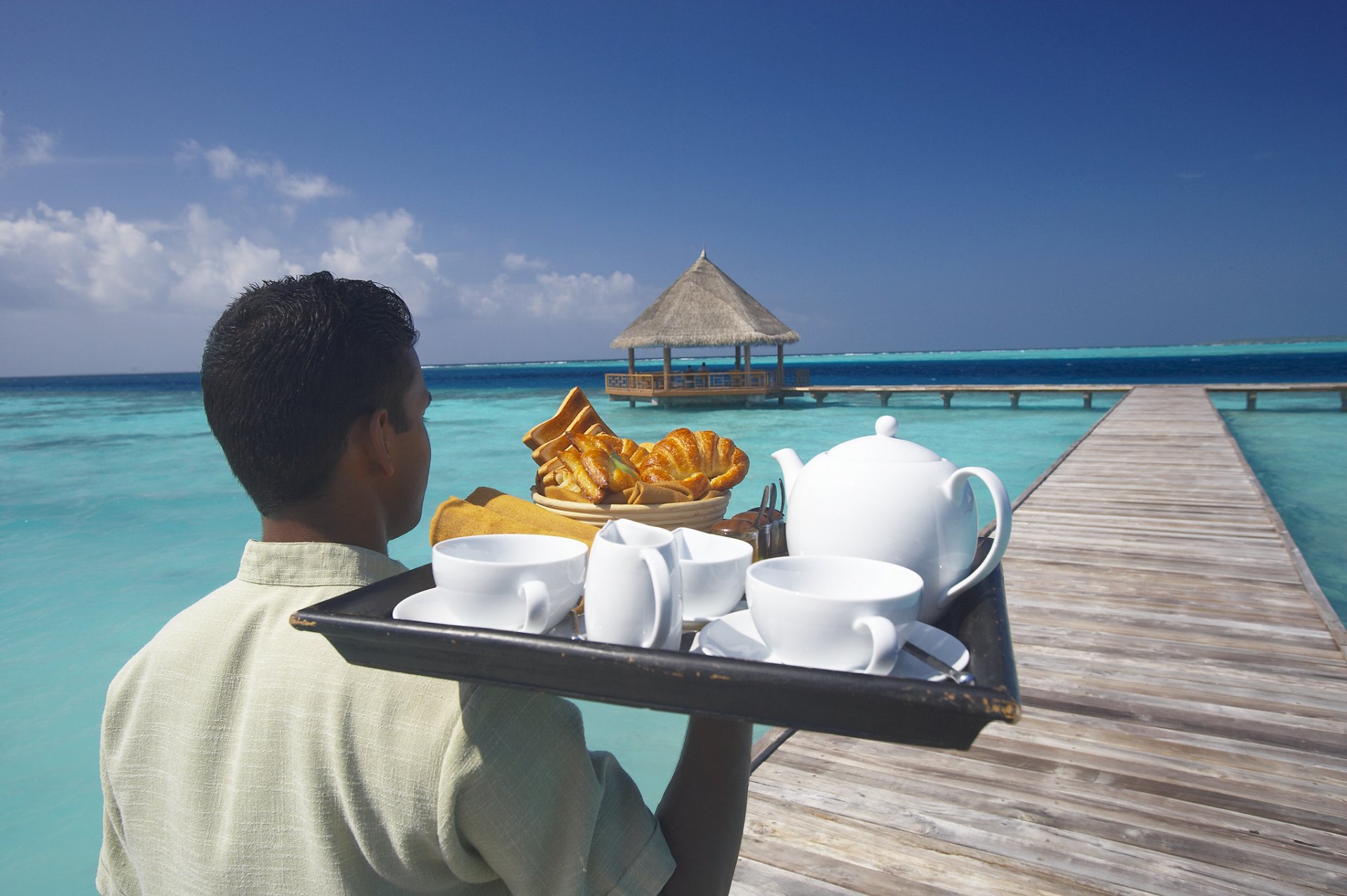 men tray food pier ocean sky cloud