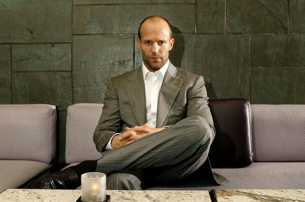 A man on the sofa in a formal suit