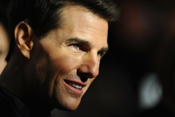 The enigmatically smiling actor Tom Cruise