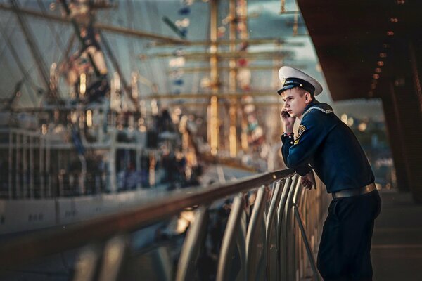 A sailor in uniform on a ship