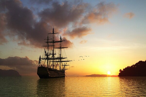 Grand navire au coucher du soleil dans la mer