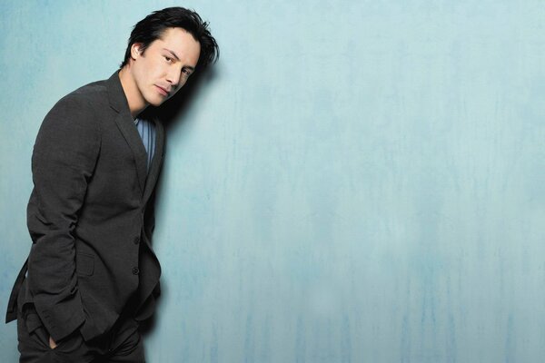 Portrait of Keanu Reeves on a blue background