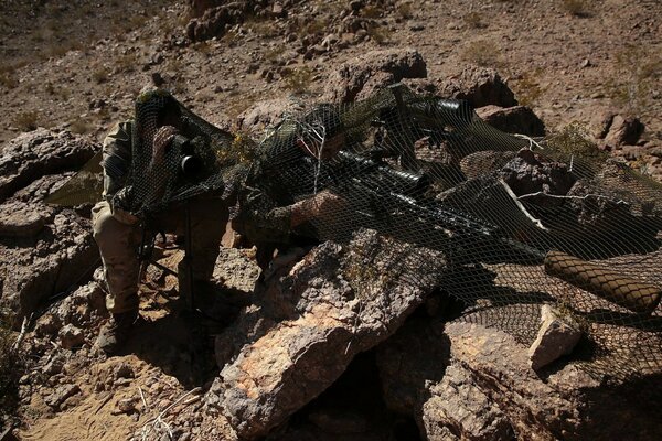 Soldiers with weapons monitor the situation