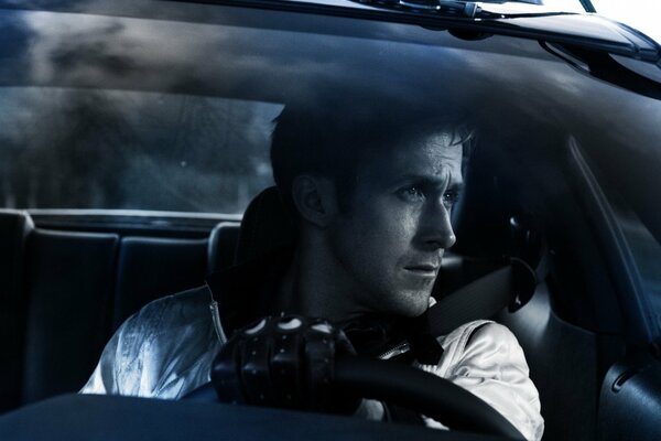 Gosling driving a car