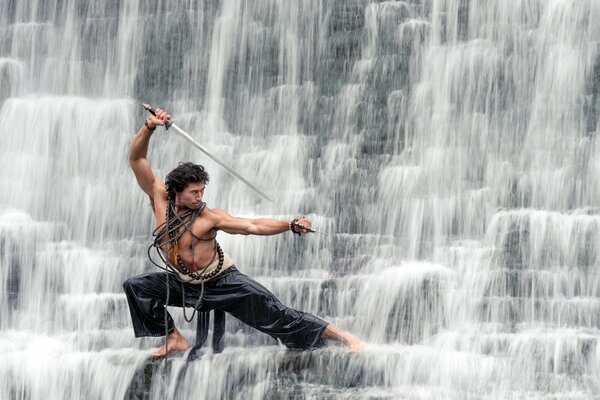 The guy at the waterfall with a saber shows kung fu