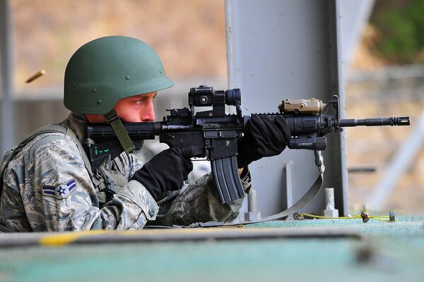 A soldier in a helmet fired a shot