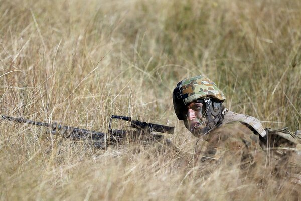 A soldier in the field at a combat post