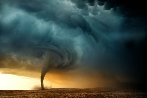 Mesmerizing tornado on the background of gray-blue sky