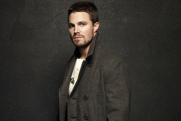 Actor Stephen Amell in a coat