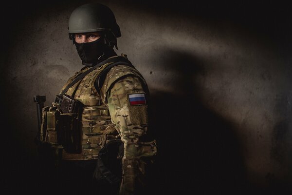 A soldier of the Russian army with his face covered