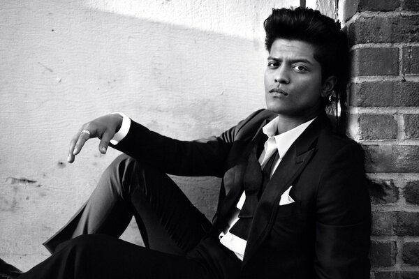 Bruno Mars in a black suit