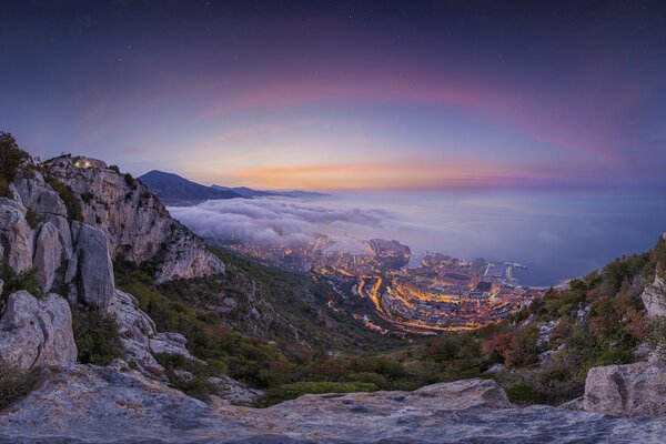 At the foot of the mountains on the seashore stretches the city of Monaco