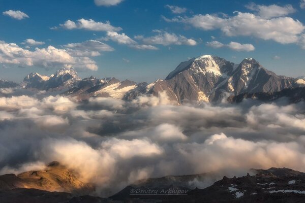 The Caucasian ridge above the clouds in winter